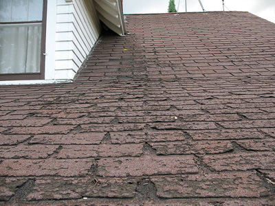 An asphalt shingle roof in disrepair; photo courtesy Dale Mahalko